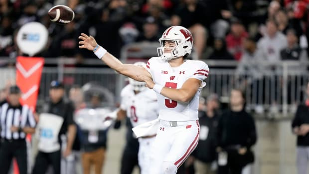 Wisconsin quarterback Graham Mertz throwing the football against Ohio State.
